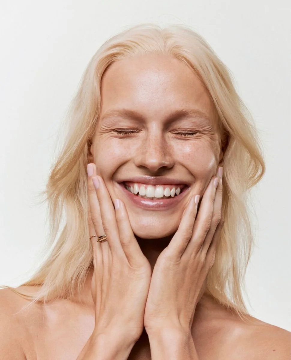A patient laughing with a bright, healthy smile
